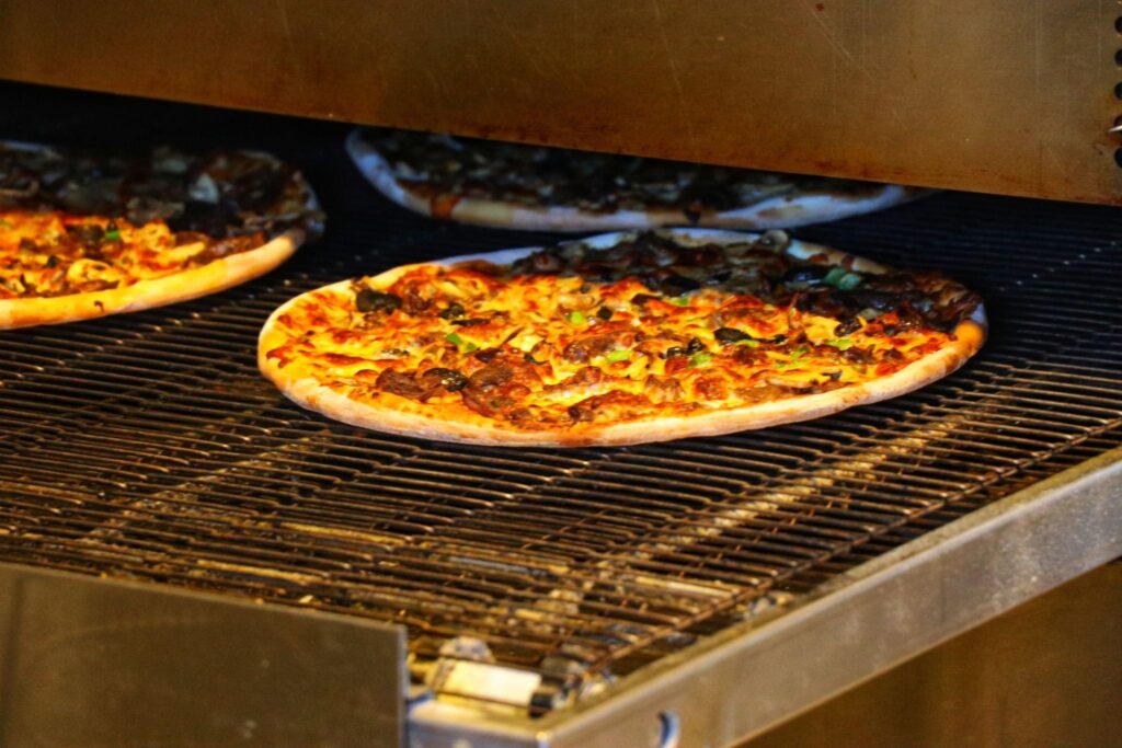 Achieving Cooked Pizza with a Traeger Pizza Oven Hack